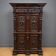 Ornate cabinet in richly carved wood in the Renaissance style.