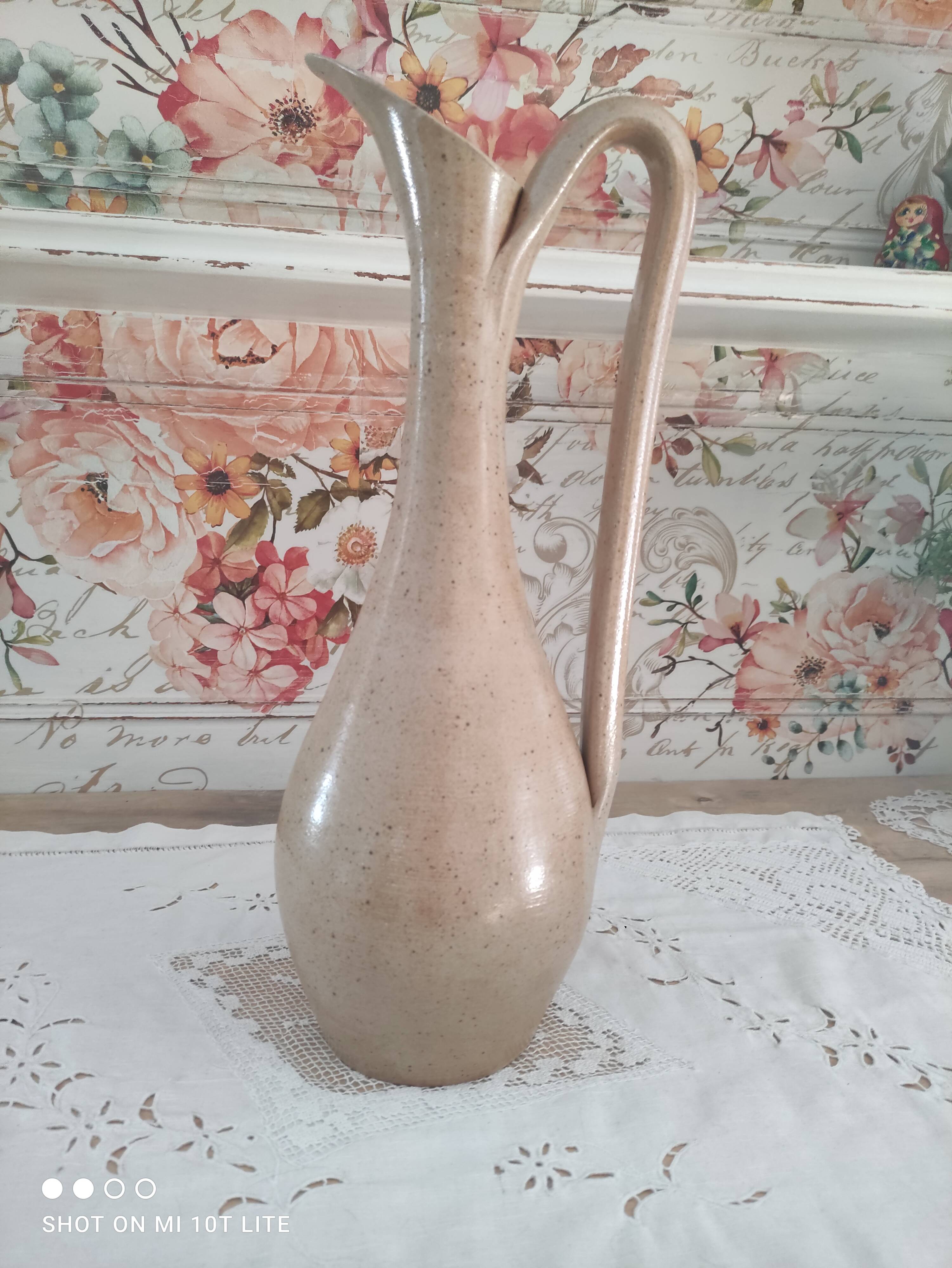 Vintage pitcher in light brown sandstone speckled