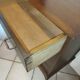 Vintage chest of drawers from the 1950s with wooden legs and a design feature.