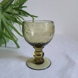 Footed glass made of blown glass