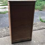 Brown lacquered wooden industrial cabinet with sliding curtain, 1950s, Czech Republic.