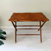 Vintage folding table with turned legs.