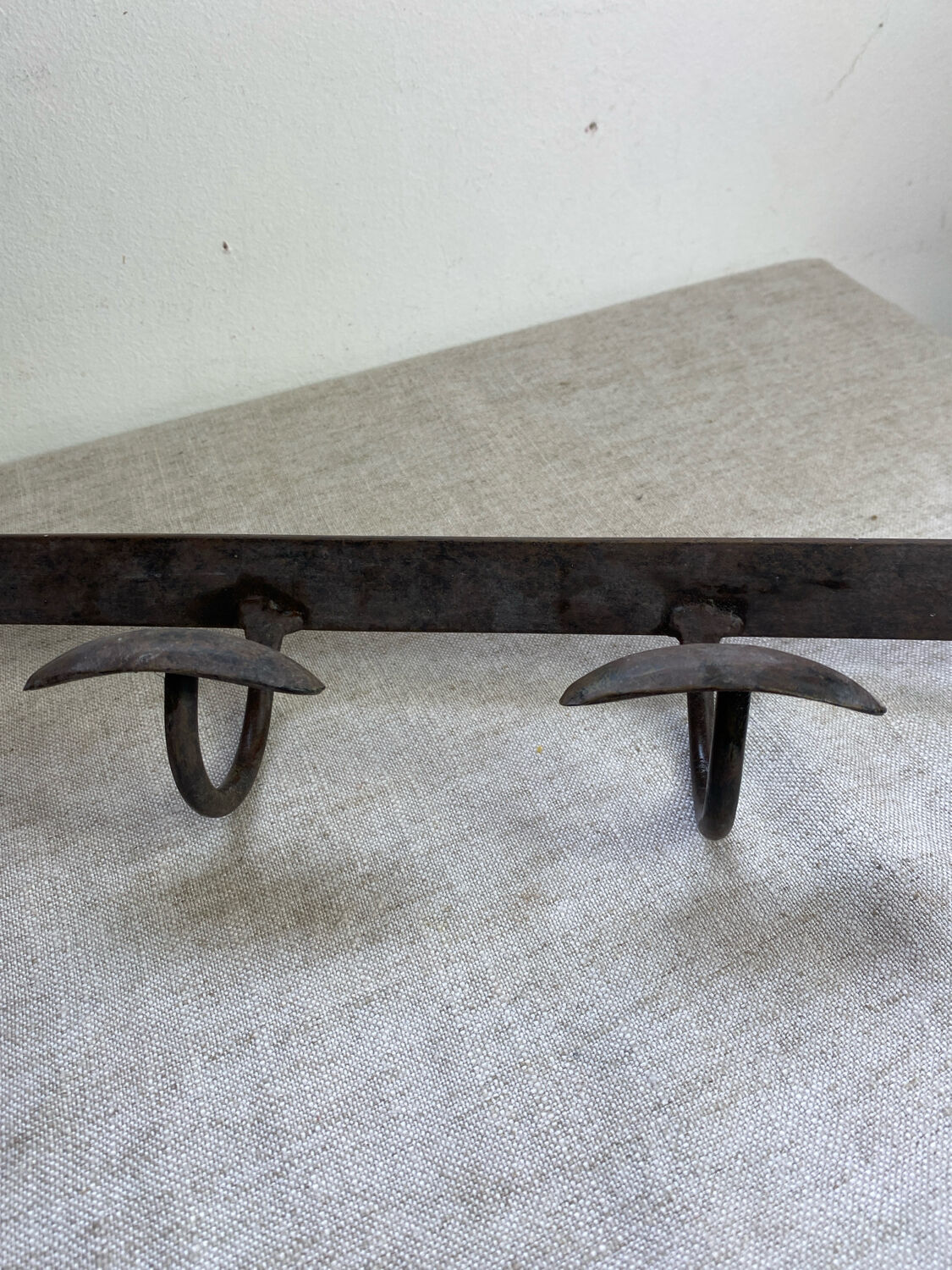 Coat rack, four hooks, in wrought iron.