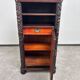 Art Nouveau cabinet with a shelf featuring distinctive floral sculptures.