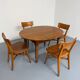Oval dining table in solid wood with turned legs from the 1950s.