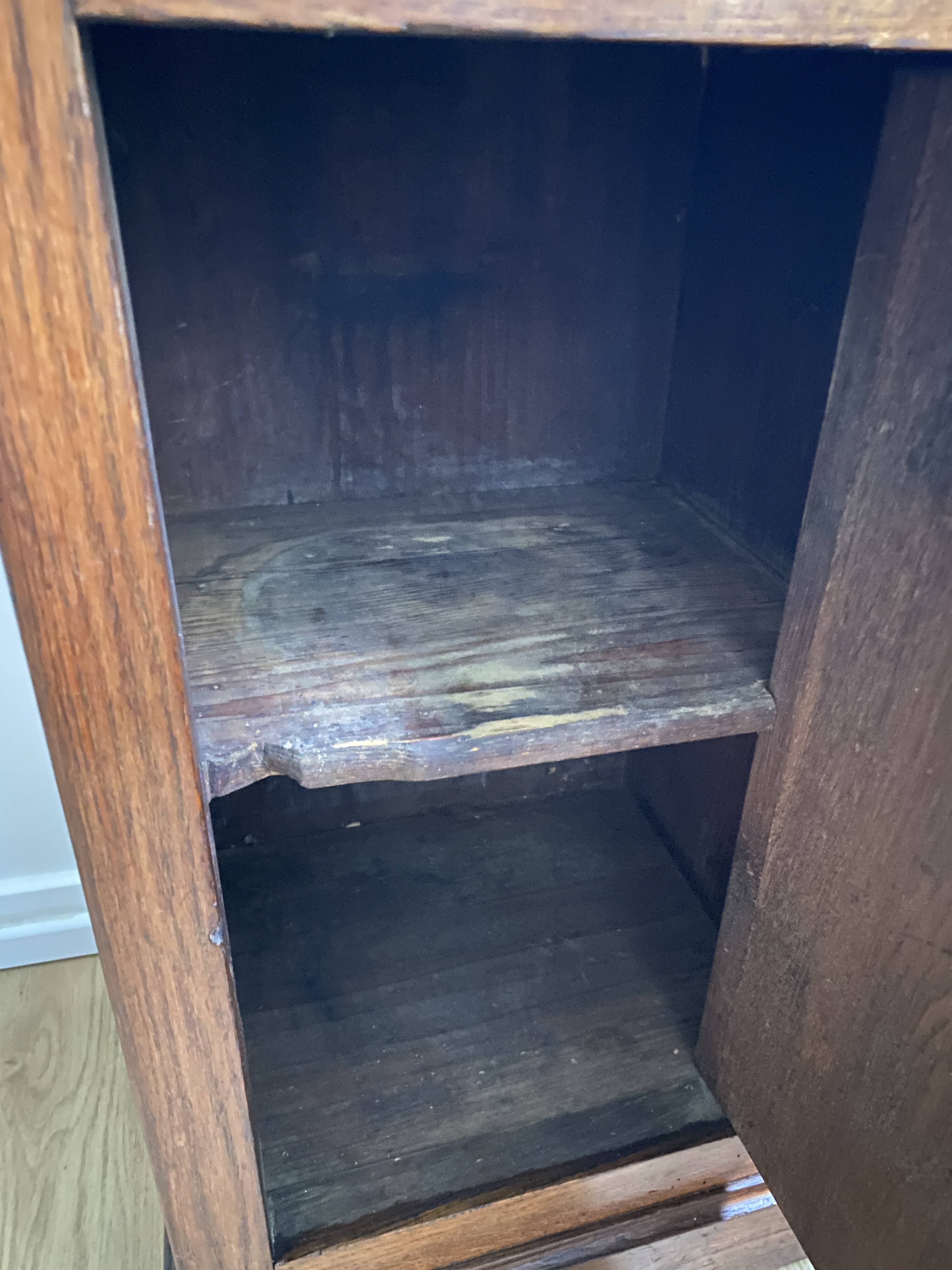 Vintage bedside table in the shape of a wooden column and a gray marble top