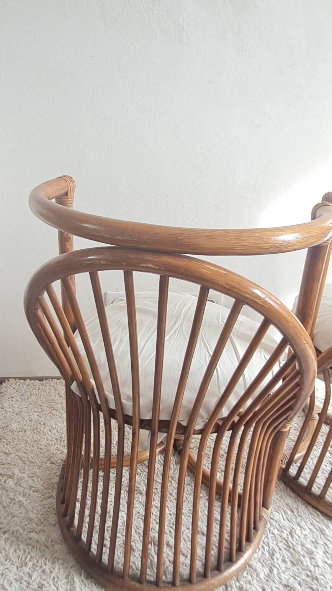 Pair of vintage rattan armchairs circa the 1960s.