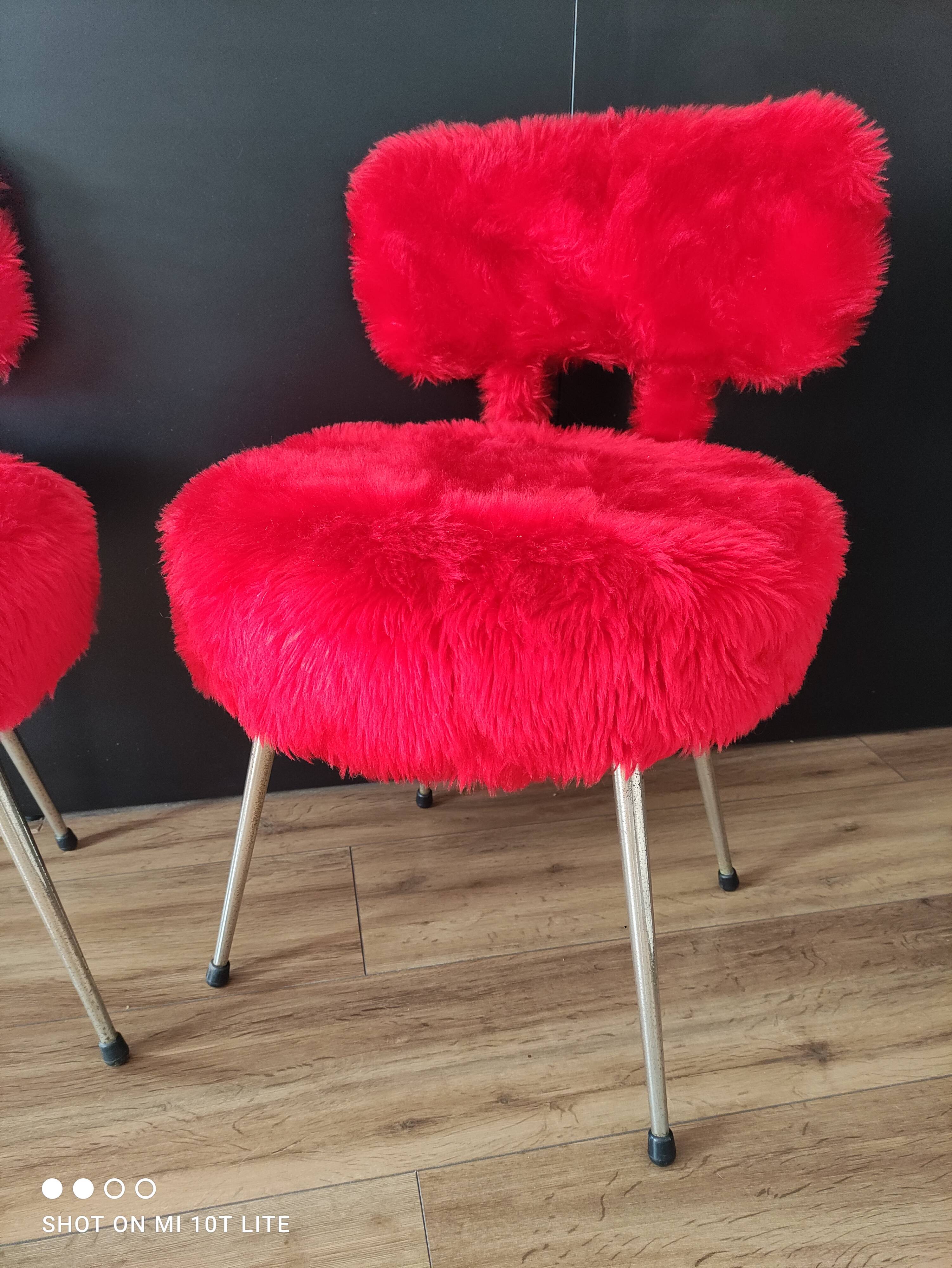 Pair of authentic cardinal red moumoute chairs from the 60s