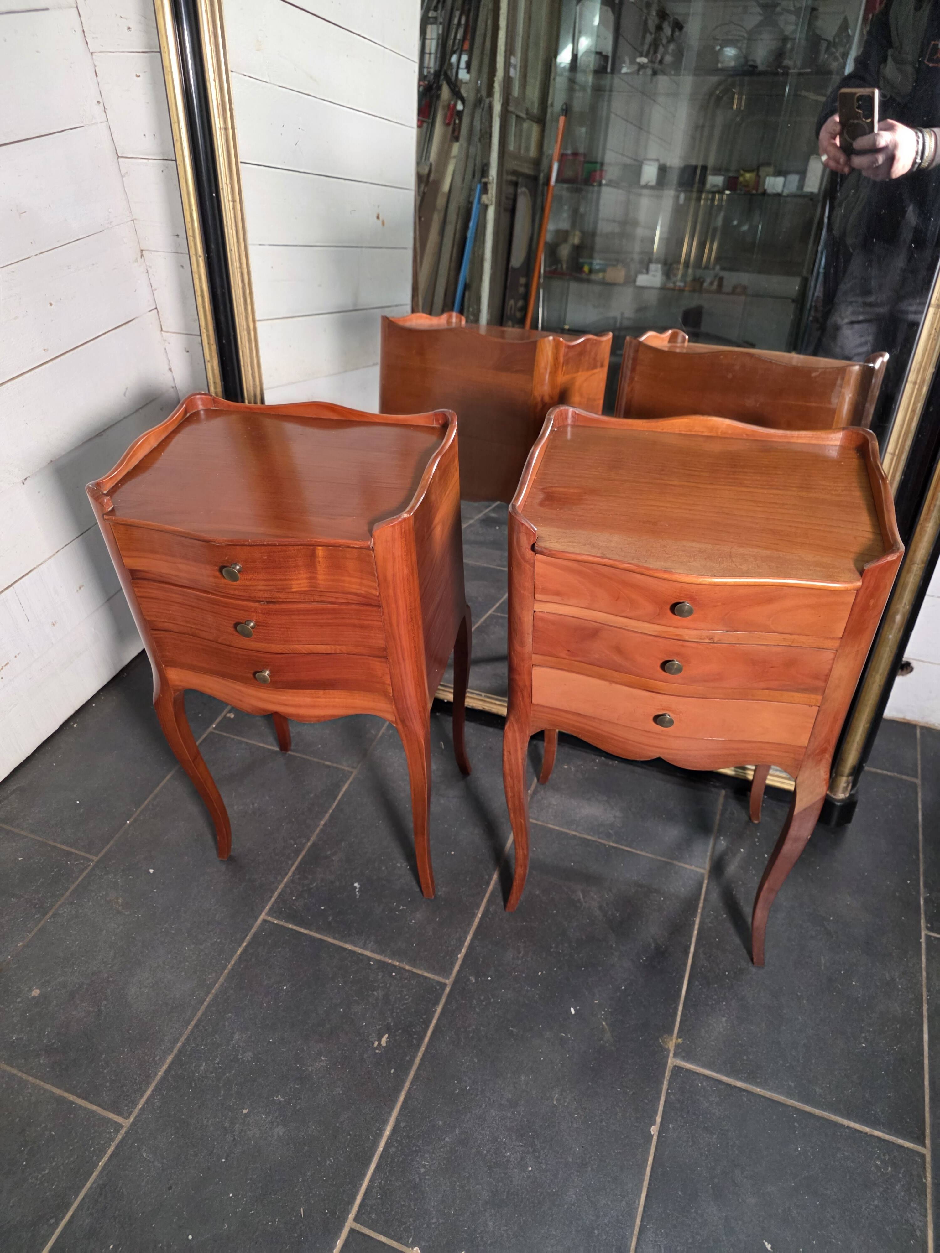 Pair of Louis XV style bedside tables in cherry wood.