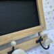 Wall-mounted coat rack with porcelain hooks