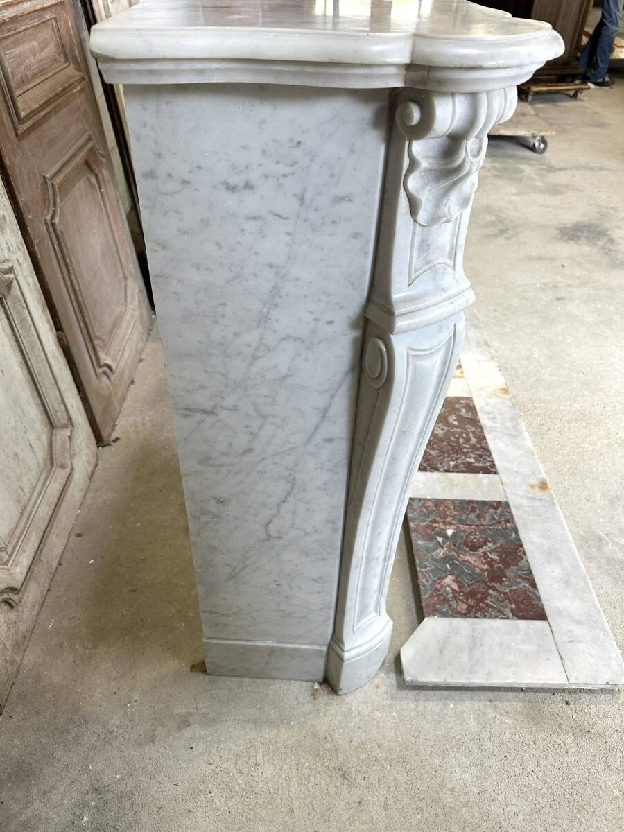 Large white marble fireplace in Louis XV style, 19th century.