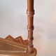 Library spiral staircase in beech and brown leather.