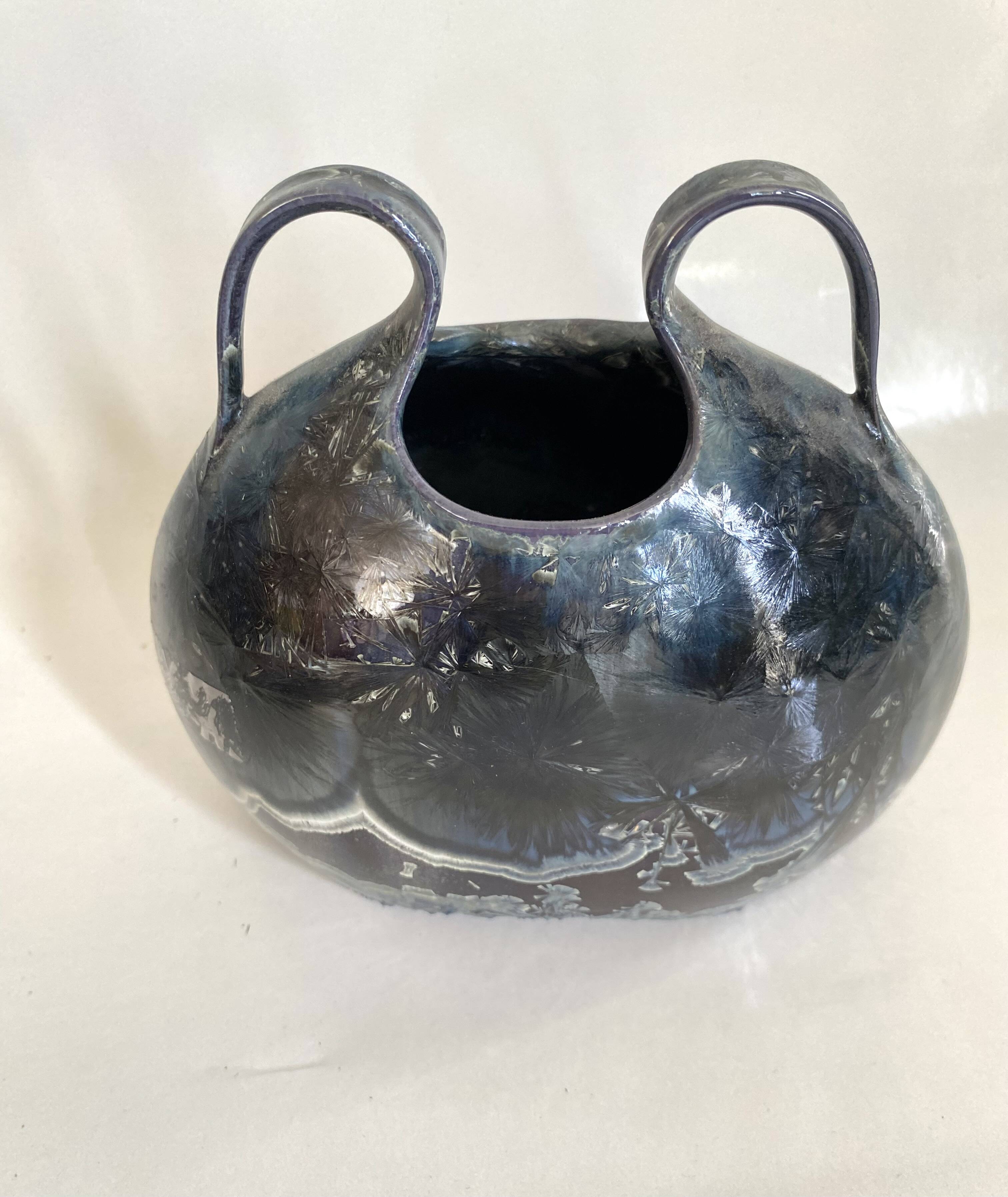 Iridescent ceramic vase with handles