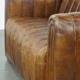 Cognac-colored cowhide 2-seater designer sofa finished with piping