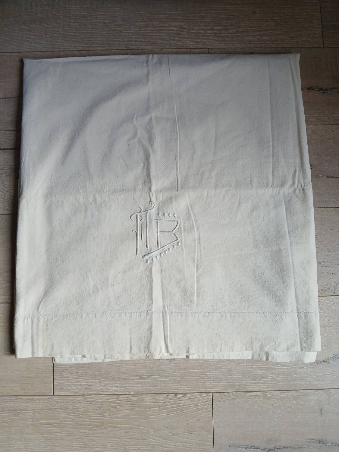 Antique sheet with embroidered initials