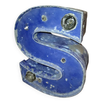 Old industrial letter in blue sheet metal illuminated commerce sign "s"