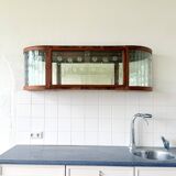 Art Deco-style wall-mounted display cabinet with floral engraving