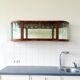 Art Deco-style wall-mounted display cabinet with floral engraving