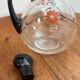 Enamelled glass carafe 1920