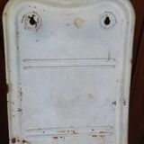 White ladle hangs with bowl