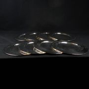Set of 8 round serving platters or saucers in vintage stainless steel