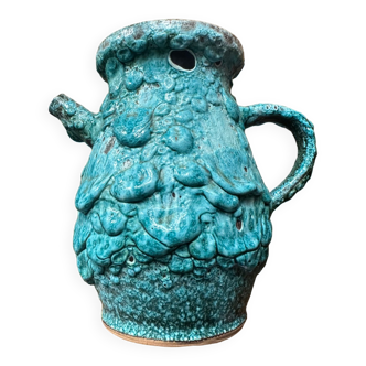 Strange ancient turquoise pitcher