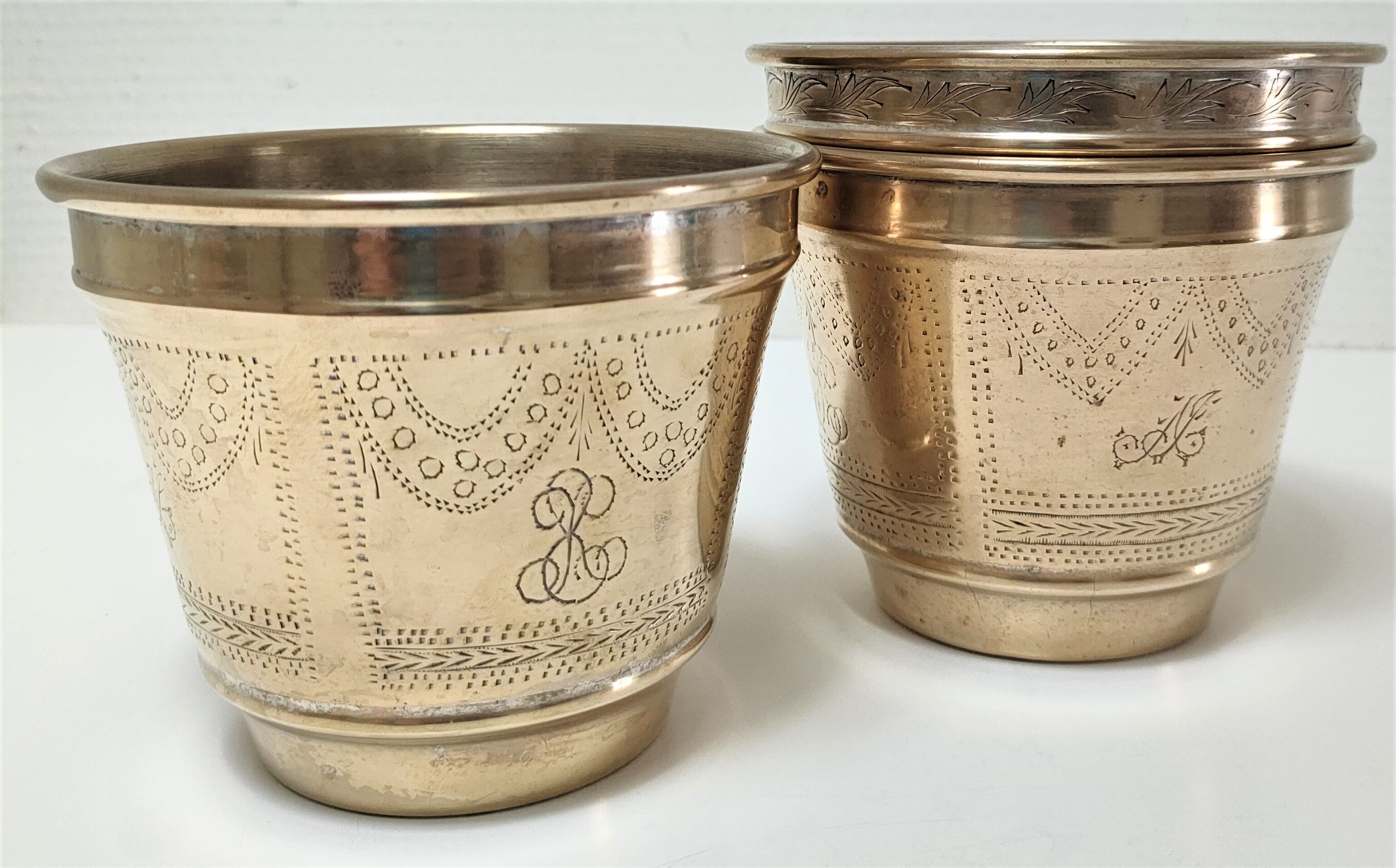Three pot covers brass silver cover golden patina monogram early twentieth century