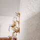 Hand-forged wall lamp gilded with gold leaf and crystals, Italy