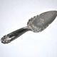 Vintage silver-plated pie server with rose decoration.