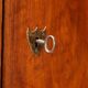 Vintage walnut wardrobe with exposed hardware.
