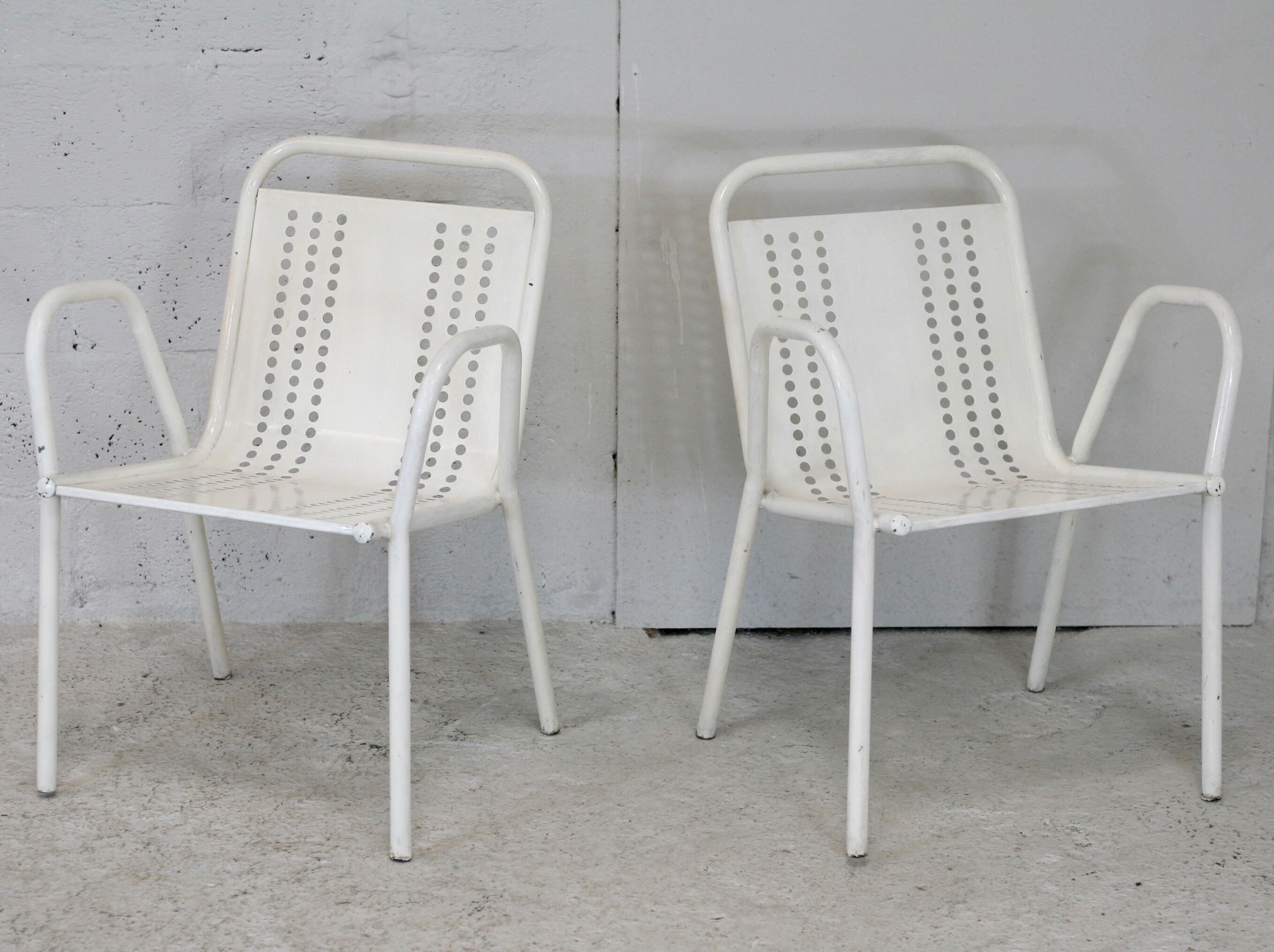 Pair of honeycomb steel armchairs. France, circa 1950.