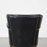 Subtle black armchair with reversible Kelim seat cushion