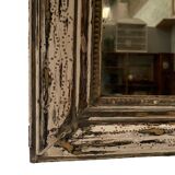 Louis Philippe mirror in wood and patinated stucco 19th century