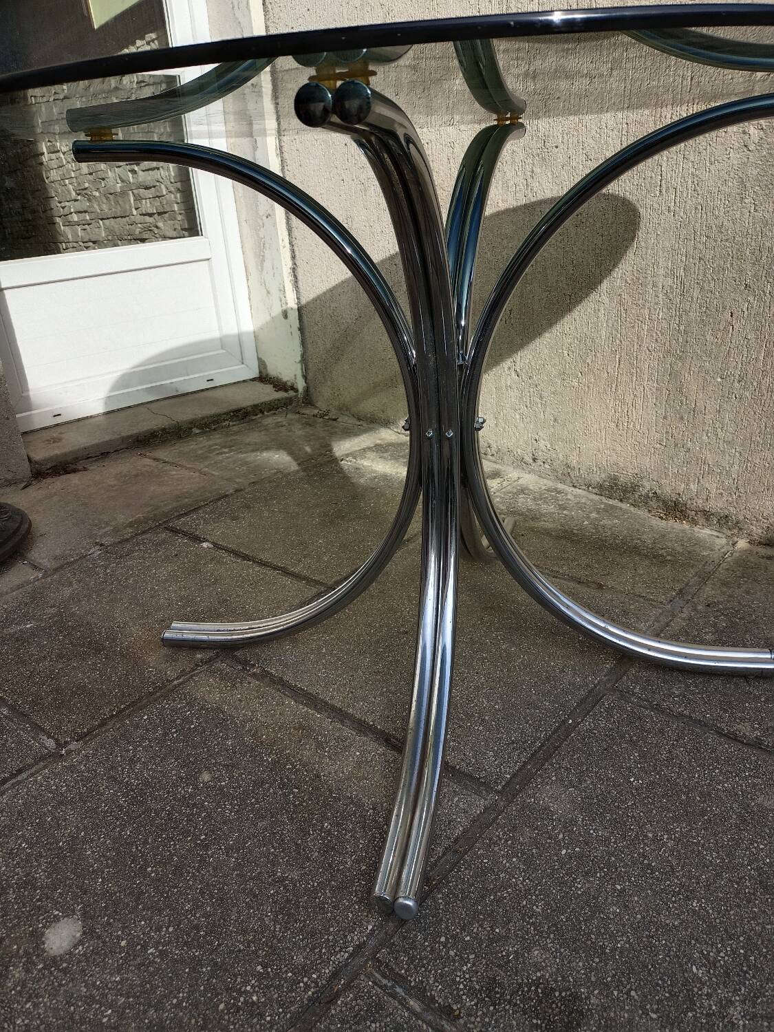 Chromed metal and smoked glass table