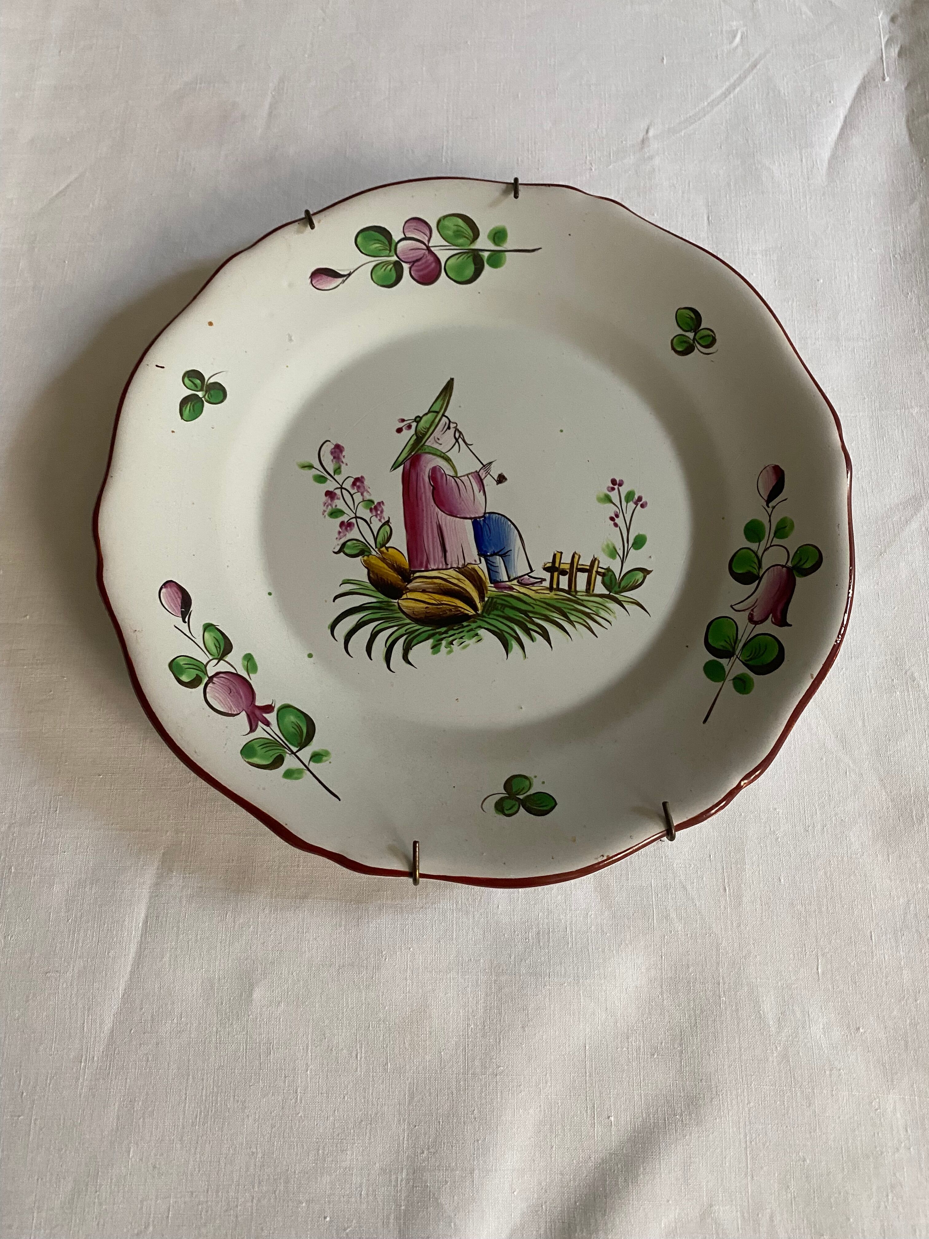 Plate of Nevers in earthenware late eighteenth century decoration of Chinese with pipe