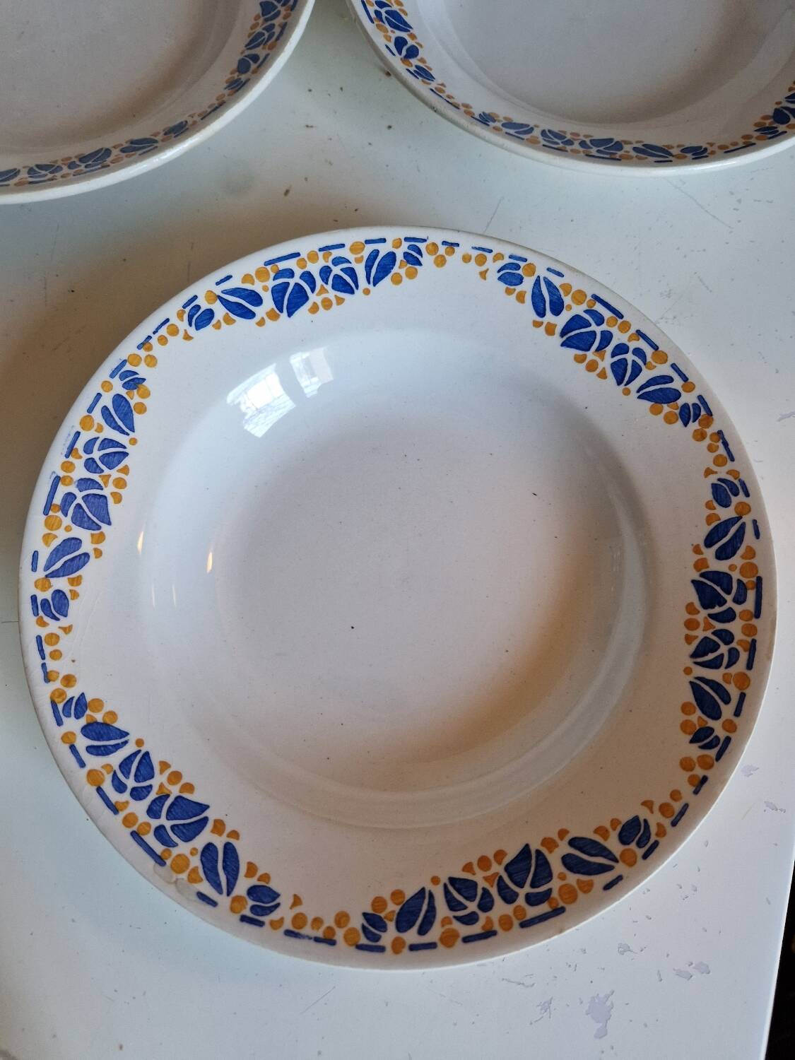 Set of 9 deep plates, earthenware from Creil Montereau, Colette model.