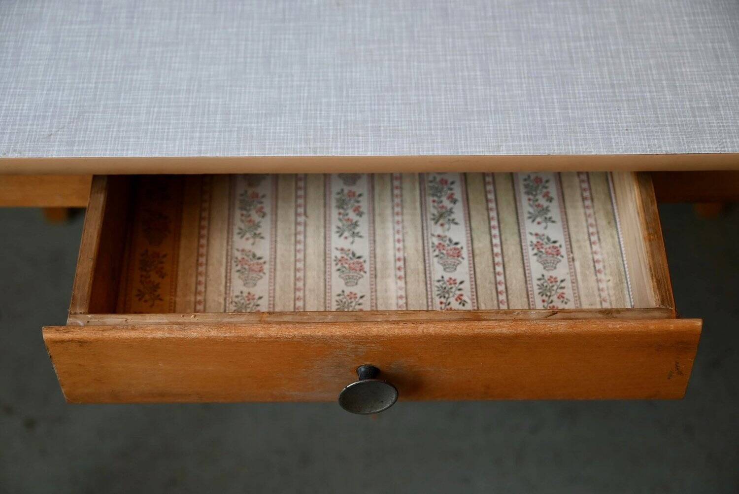 1950s Formica kitchen table with tapered legs and vintage drawer.