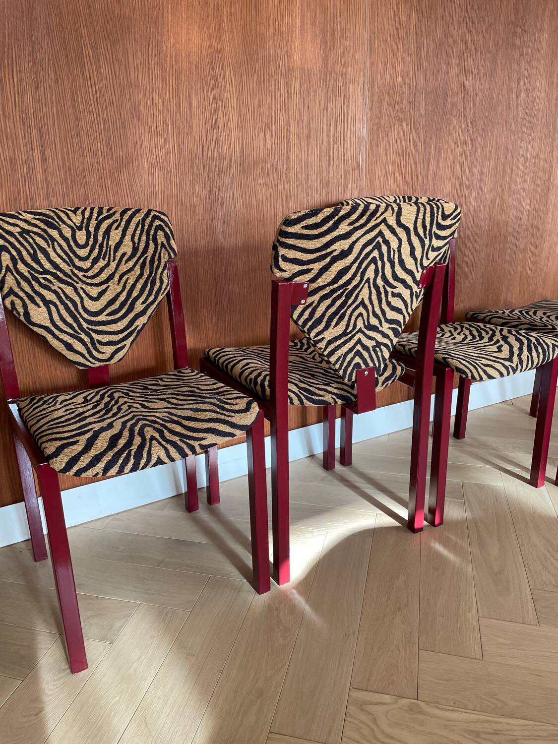 4 red lacquered zebra chairs