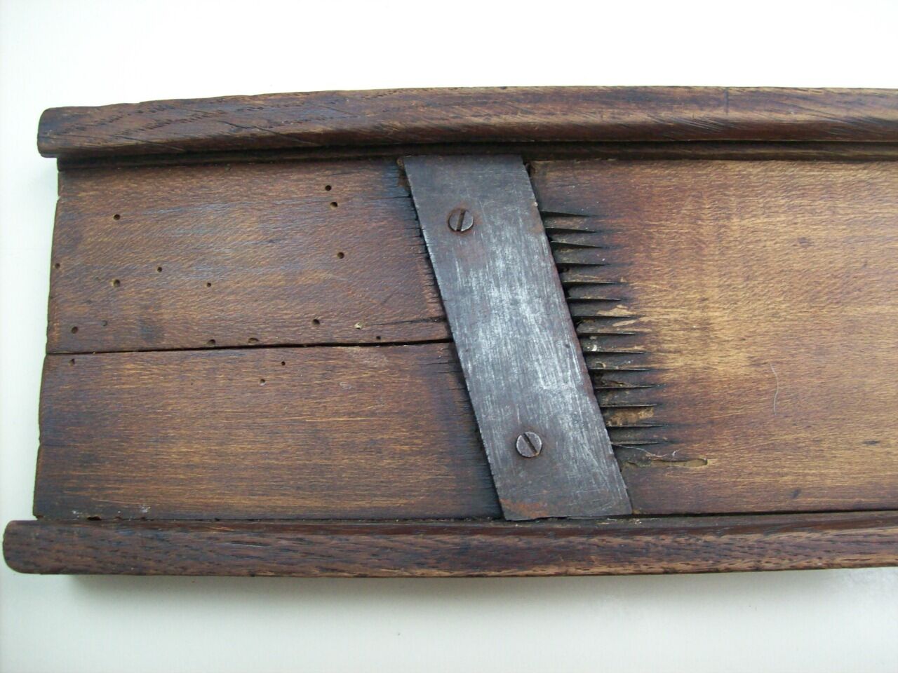 Old kitchen mandolin in wood and iron double blades