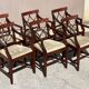 English Sheraton-style mahogany dining room set from the 20th century.