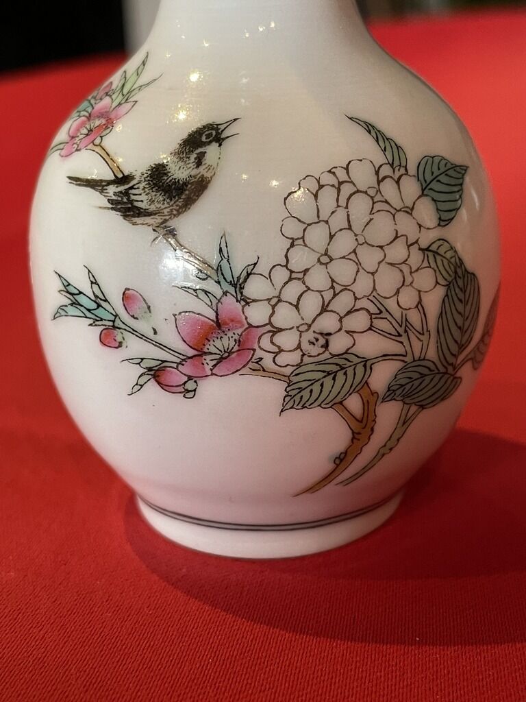 Porcelain vase decorated with flowers and birds