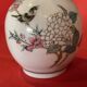 Porcelain vase decorated with flowers and birds