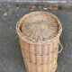 Woven laundry basket with rattan and wicker lid