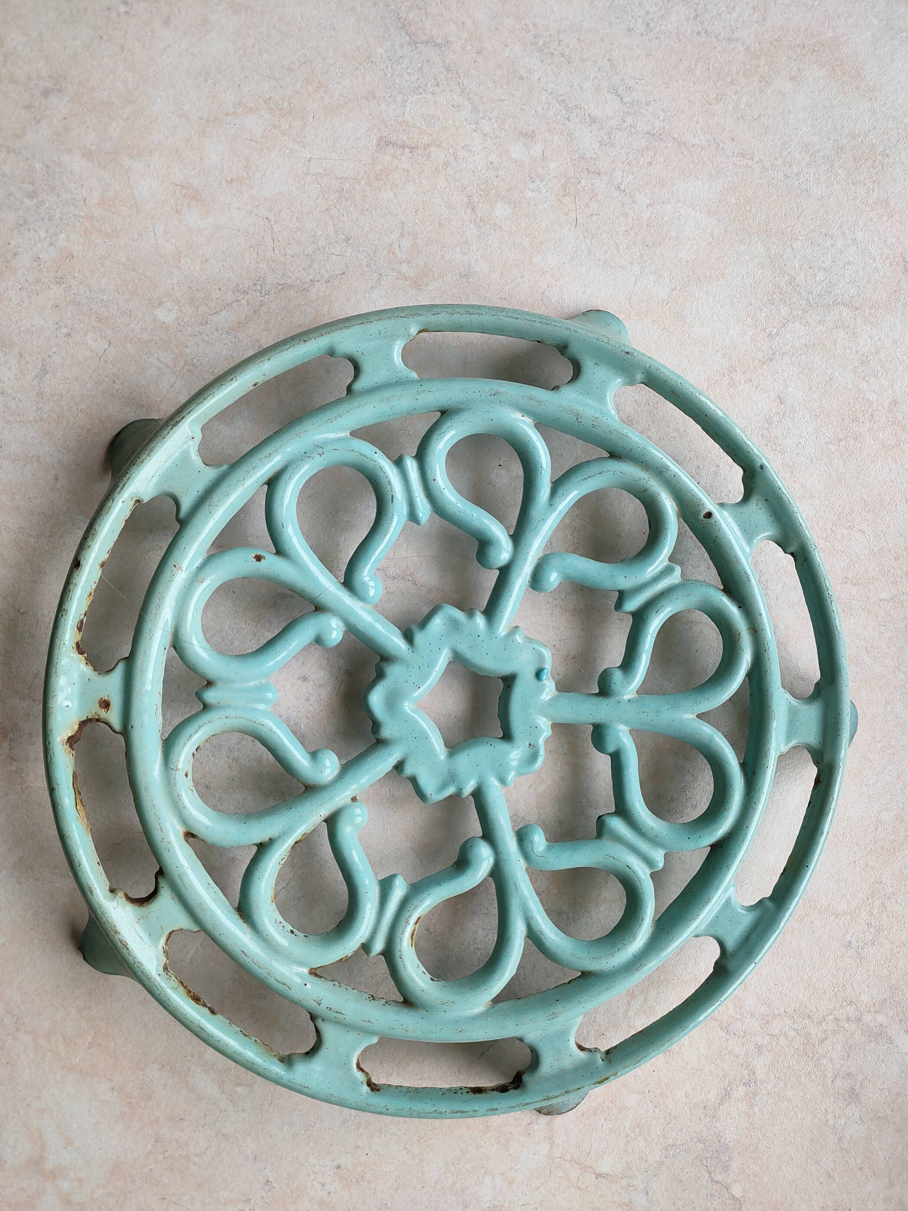 Water green enamelled trivet.