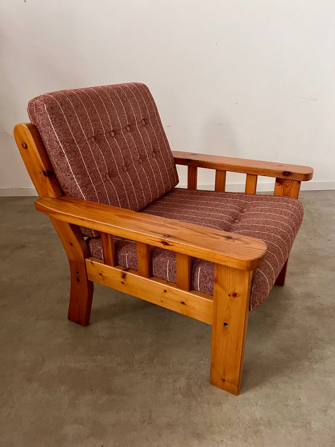 Old vintage Scandinavian design pine armchair from the 70s