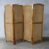 Handcrafted screen in exotic wood and rope.