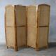 Handcrafted screen in exotic wood and rope.