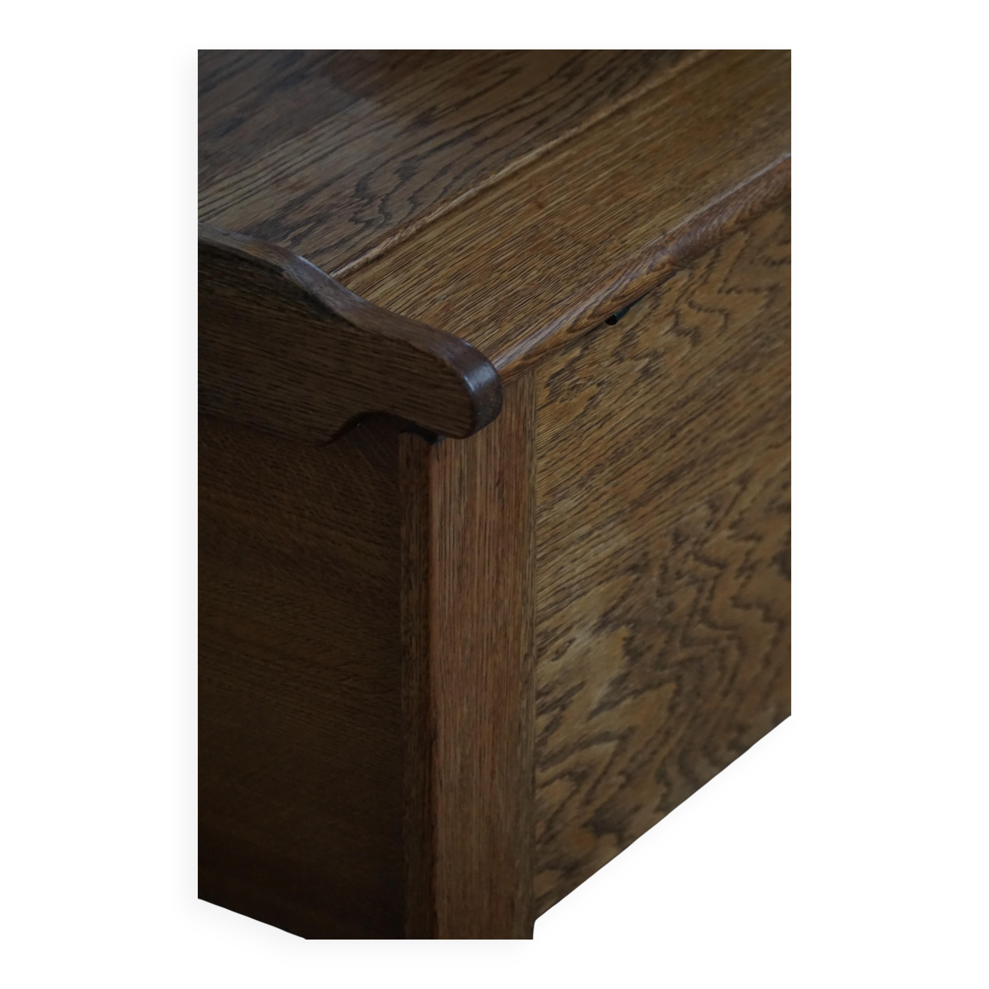 Modern Danish oak commode with decorative relief sculpture, mid-20th century.