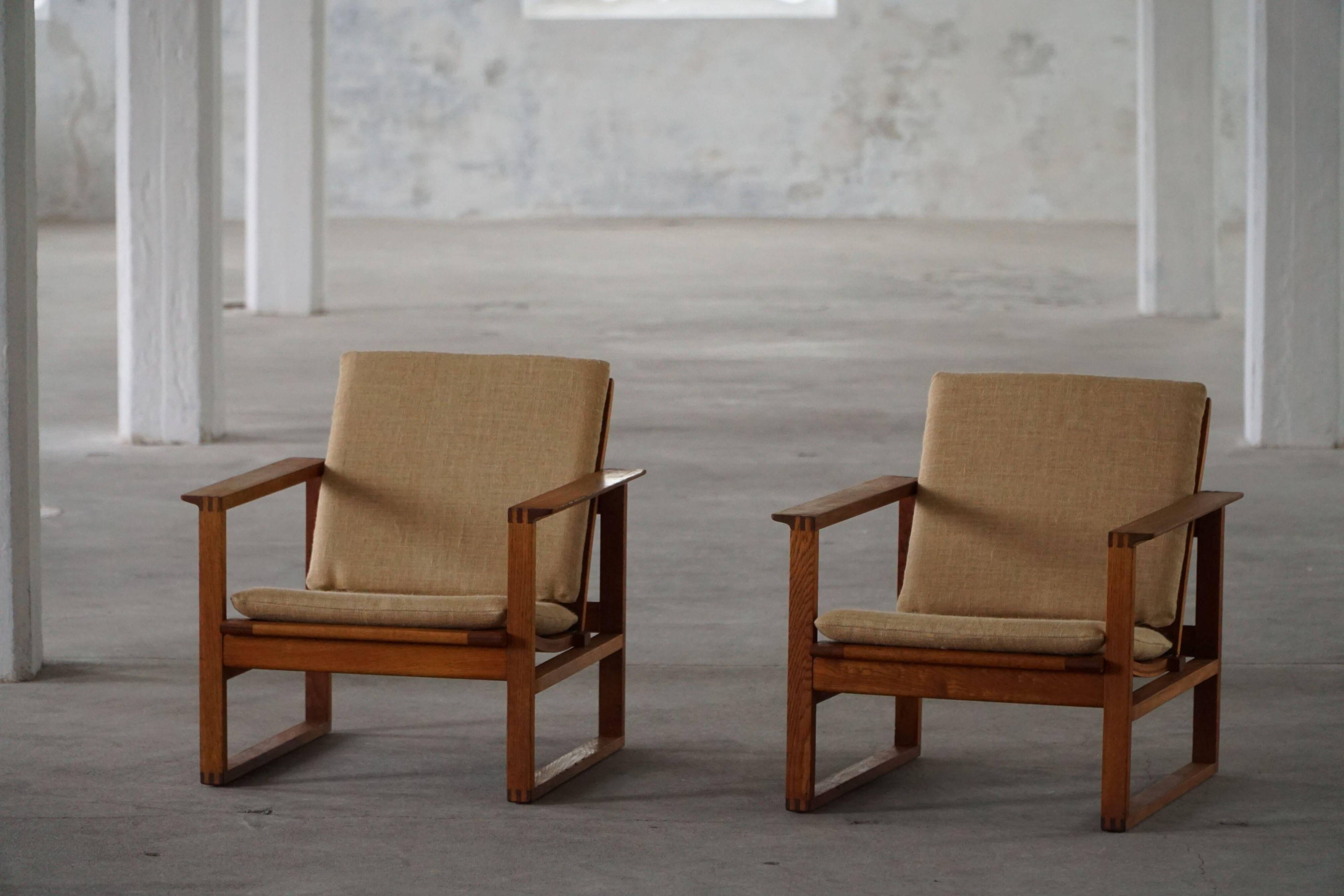 Børge Mogensen, a pair of BM2256 lounge chairs in oak and jute, Denmark, 1960s.