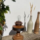 Foot of turned wooden lamp and carved